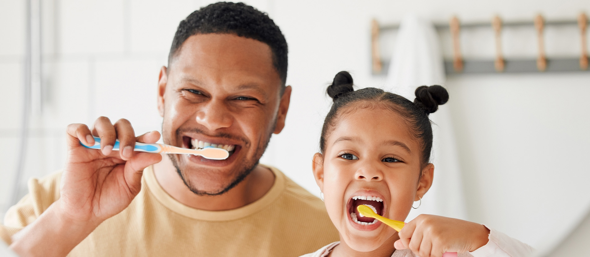 A man and a child brushing their teeth, captured in a split-image format.